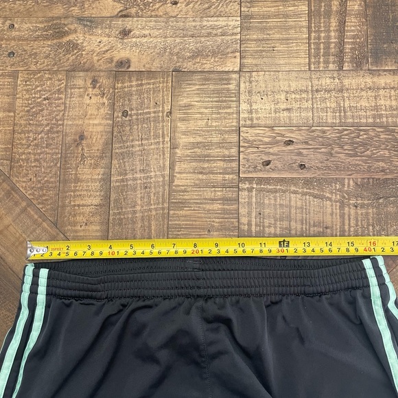 women's black Adidas track pants with mint or light green stripes - Picture 6 of 6